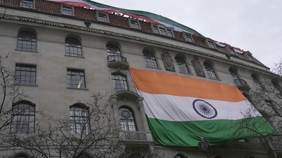 After the National Flag was pulled down by Khalistan supporters on Sunday ina protest against India's operation on Amritpal Singh, a bigger flag was put up on the high commission building. (AP) After the National Flag was pulled down by Khalistan supporters on Sunday ina protest against India's operation on Amritpal Singh, a bigger flag was put up on the high commission building. (AP)