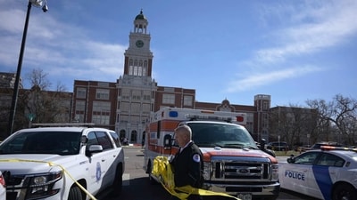 Emergency personnel remove police tape outside East High School after a school shooting. (AP) Emergency personnel remove police tape outside East High School after a school shooting. (AP)