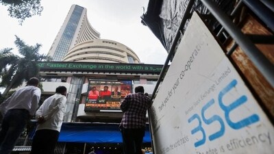 People stand outside the Bombay Stock Exchange (BSE). (REUTERS)