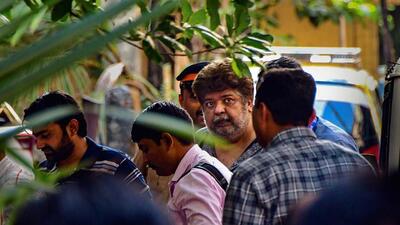 Mumbai: Alleged bookie Anil Jaisinghani being taken to custody after a court remanded him to police custody till March 27 in a case related to alleged attempt to blackmail and bribe Amruta Fadnavis, wife of Maharashtra Deputy CM Devendra Fadnavis, in Mumbai, Tuesday, March 21, 2023. (PTI Photo)(PTI03_21_2023_000344A) (PTI) Mumbai: Alleged bookie Anil Jaisinghani being taken to custody after a court remanded him to police custody till March 27 in a case related to alleged attempt to blackmail and bribe Amruta Fadnavis, wife of Maharashtra Deputy CM Devendra Fadnavis, in Mumbai, Tuesday, March 21, 2023. (PTI Photo)(PTI03_21_2023_000344A) (PTI)
