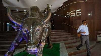 A man walks past the BSE bull on the day of tabling of Union Budget 2023-24, at Bombay Stock Exchange in Mumbai. (PTI) A man walks past the BSE bull on the day of tabling of Union Budget 2023-24, at Bombay Stock Exchange in Mumbai. (PTI)