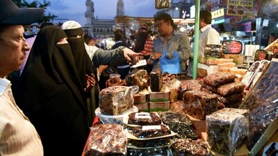 People purchase dates ahead of the fasting month of Ramzan in the old city of Hyderabad. (PTI)