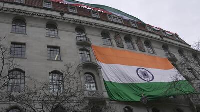 People show an Indian flag from the roof of the Indian High Commission as protestors of the Khalistan movement demonstrate on the streets in London on Wednesday. (AP) People show an Indian flag from the roof of the Indian High Commission as protestors of the Khalistan movement demonstrate on the streets in London on Wednesday. (AP)