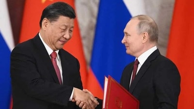 Russian President Vladimir Putin and China's President Xi Jinping shake hands during a signing ceremony following their talks at the Kremlin in Moscow. (HT_PRINT) Russian President Vladimir Putin and China's President Xi Jinping shake hands during a signing ceremony following their talks at the Kremlin in Moscow. (HT_PRINT)