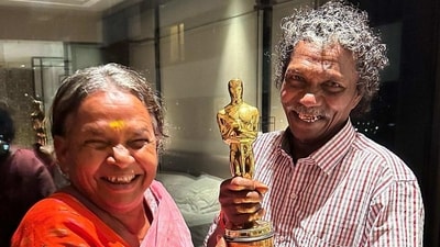 The Elephant Whisperers' Bomman and Belli with the Oscars trophy. The Elephant Whisperers' Bomman and Belli with the Oscars trophy.