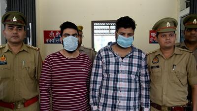 Tw of the three people arrested for the staged robbery, in Noida on Thursday. (Sunil Ghosh /HT PHOTO)