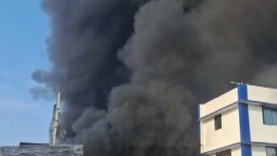 Screengrab of video showing clouds of smoke emanating from the building which caught fire. (ANI)