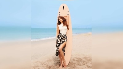 In the photos, Kiara Advani can be seen wearing a white turtleneck bodysuit which she teamed with a slit tie-dye print skirt. (Instagram/@kiaraaliaadvani) In the photos, Kiara Advani can be seen wearing a white turtleneck bodysuit which she teamed with a slit tie-dye print skirt. (Instagram/@kiaraaliaadvani)