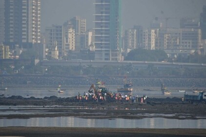 Mystery dargah in Mahim: BMC worker demolishing the ‘illegal dargah’ construction, near Mahim Bay. (Bhushan Koyande)