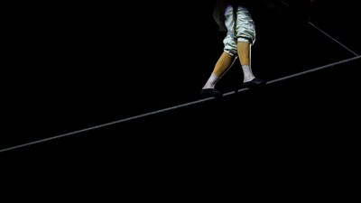 Petit, best known for his walk between the Twin Towers of the World Trade Center in New York City, performed on a high wire, 50 feet above the Great Hall at the National Building Museum, reported AFP.&nbsp; ( Kevin Dietsch/Getty Images/AFP)
