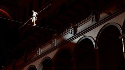 Philippe Petit, the French high wire artist, walks on a high wire during his show "Wonder on the Wire," at the National Building Museum on March 23, in Washington DC. Even at his advanced age, Petit still plans to make the walk without safety net or harness, reported AFP.&nbsp; (Kevin Dietsch/Getty Images/AFP)
