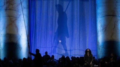 Guests watch Philippe Petit perform "Wonder on the Wire" above diners during a fundraiser at the National Building Museum. “Two performances are never the same... each time is an adventure where I learn, where I discover,” Petit told AFP.&nbsp; (Brendan Smialowski / AFP)