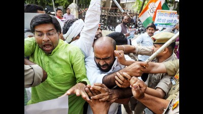 Congress supporters stage a protest march over party leader Rahul Gandhi's disqualification as a Member of the Lok Sabha (MP), in Lucknow on Friday. (ANI Photo)
