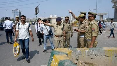 Noida traffic police officers inspect the Model Town intersection on Thursday. (Sunil Ghosh/HT Photo) Noida traffic police officers inspect the Model Town intersection on Thursday. (Sunil Ghosh/HT Photo)