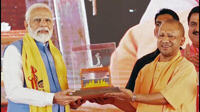 Prime Minister Narendra Modi being felicitated by Uttar Pradesh chief minister Yogi Adityanath during the dedication and stone laying foundation ceremony of various projects in Varanasi on Friday. (ANI PHOTO) Prime Minister Narendra Modi being felicitated by Uttar Pradesh chief minister Yogi Adityanath during the dedication and stone laying foundation ceremony of various projects in Varanasi on Friday. (ANI PHOTO)