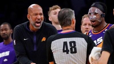 Phoenix Suns head coach Monty Williams, left, and forward Josh Okogie, right, complain to referee Scott Foster about an offensive foul call during the second half of an NBA basketball game Los Angeles Lakers Wednesday, March 22, 2023, in Los Angeles. The call was later overturned after review. (AP) Phoenix Suns head coach Monty Williams, left, and forward Josh Okogie, right, complain to referee Scott Foster about an offensive foul call during the second half of an NBA basketball game Los Angeles Lakers Wednesday, March 22, 2023, in Los Angeles. The call was later overturned after review. (AP)