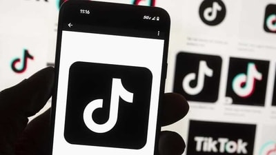 The TikTok logo is seen on a cell phone.