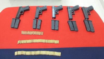 The five pistols, 10 magazines and bullets dropped by a Pakistani drone that the BSF recovered from a field near Metla village of Dera Baba Nanak sub division of Gurdaspur district in Punjab on Friday. (HT Photo)