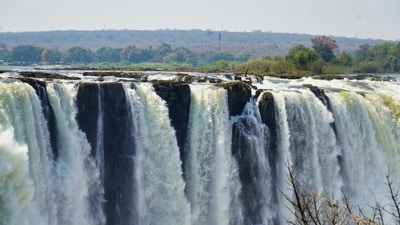 Victoria Falls, Zambia and Zimbabwe: Located on the Zambezi River, Victoria Falls is one of the world's largest waterfalls. It is also known as "Mosi-oa-Tunya," which means "the smoke that thunders" in the local Tonga language. (Unsplash) Victoria Falls, Zambia and Zimbabwe: Located on the Zambezi River, Victoria Falls is one of the world's largest waterfalls. It is also known as "Mosi-oa-Tunya," which means "the smoke that thunders" in the local Tonga language. (Unsplash)