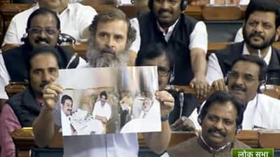 Congress leader Rahul Gandhi showing old photo of Gautam Adani with then Gujarat chief minister Narendra Modi.
