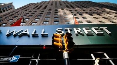 A sign for a Wall Street building is shown, (AP file photo) A sign for a Wall Street building is shown, (AP file photo)