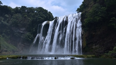Huangguoshu Waterfall, China: Located in Guizhou province, Huangguoshu Waterfall is the largest waterfall in Asia. It is also known as "Yellow Fruit Tree Waterfall" due to the fruit trees that grow nearby. (Unsplash) Huangguoshu Waterfall, China: Located in Guizhou province, Huangguoshu Waterfall is the largest waterfall in Asia. It is also known as "Yellow Fruit Tree Waterfall" due to the fruit trees that grow nearby. (Unsplash)