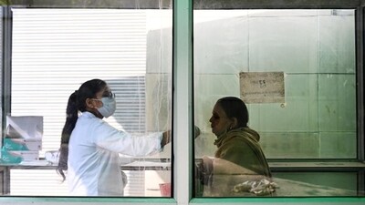 A health worker collects a swab sample for Covid-19 test at the District Hospital in Sector 30 in Noida on December 31. (Sunil Ghosh/HT Photo) A health worker collects a swab sample for Covid-19 test at the District Hospital in Sector 30 in Noida on December 31. (Sunil Ghosh/HT Photo)