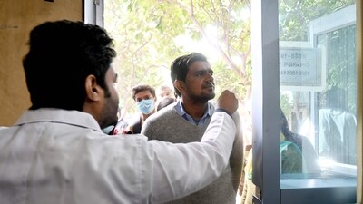 India Covid Cases: A health worker collects a swab sample for Covid-19 test at the District Hospital in Noida. (Hindustan Times) India Covid Cases: A health worker collects a swab sample for Covid-19 test at the District Hospital in Noida. (Hindustan Times)