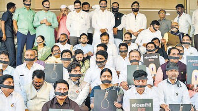 Mumbai, India - March 25, 2023: Opposition party MLAs and MLCs wearing black tape on their mouths protest during the Maharashtra Budget Session, at Vidhan Bhavan, Nariman Point, in Mumbai, India, on Saturday, March 25, 2023. (Photo by Satish Bate/ Hindustan Times) (Satish Bate/HT PHOTO) Mumbai, India - March 25, 2023: Opposition party MLAs and MLCs wearing black tape on their mouths protest during the Maharashtra Budget Session, at Vidhan Bhavan, Nariman Point, in Mumbai, India, on Saturday, March 25, 2023. (Photo by Satish Bate/ Hindustan Times) (Satish Bate/HT PHOTO)