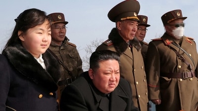 North Korean leader Kim Jong Un and his daughter Kim Ju Ae watch a missile drill at an undisclosed location in this image released by North Korea's Central News Agency (KCNA) on March 20. (via REUTERS)