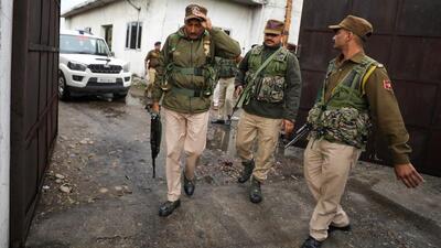 Security personnel inspect the blast area near a scrap factory at Baribrahamana in Jammu on Saturday. (PTI)