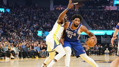 Joel Embiid #21 of the Philadelphia 76ers dribbles the ball in the first quarter against Draymond Green #23 of the Golden State Warriors at Chase Center on March 24, 2023 in San Francisco, California. (Getty Images via AFP) Joel Embiid #21 of the Philadelphia 76ers dribbles the ball in the first quarter against Draymond Green #23 of the Golden State Warriors at Chase Center on March 24, 2023 in San Francisco, California. (Getty Images via AFP)