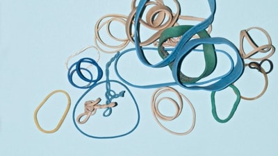 Use a rubber band to secure toiletry lids: To prevent leaks and spills, use a rubber band to secure the lids of your toiletries before packing them. (Unsplash) Use a rubber band to secure toiletry lids: To prevent leaks and spills, use a rubber band to secure the lids of your toiletries before packing them. (Unsplash)