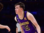 Los Angeles Lakers guard Austin Reaves (15) moves the ball against Oklahoma City Thunder guard Josh Giddey (3) during the second half at Crypto.com Arena.