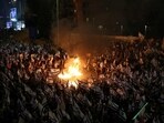 People attend a demonstration after Israeli Prime Minister Benjamin Netanyahu dismissed the defense minister and his nationalist coalition government presses on with its judicial overhaul, in Tel Aviv, Israel, Sunday.