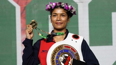 Nikhat Zareen poses for a photo with her belt and the gold medal (ANI) Nikhat Zareen poses for a photo with her belt and the gold medal (ANI)