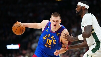 Denver Nuggets center Nikola Jokic (15) drives at Milwaukee Bucks forward Bobby Portis (9) during the second half at Ball Arena. (USA TODAY Sports)