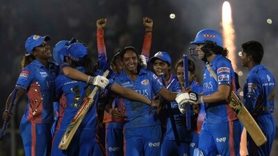 Mumbai Indians captain Harmanpreet Kaur, centre without cap, celebrates with teammates their win in the Women's Premier League Twenty20 cricket final match against Delhi Captials in Mumbai. (AP) Mumbai Indians captain Harmanpreet Kaur, centre without cap, celebrates with teammates their win in the Women's Premier League Twenty20 cricket final match against Delhi Captials in Mumbai. (AP)
