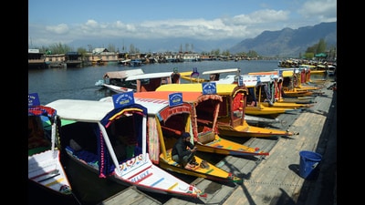 Shikaras anchored on the banks of Dal lake, in Srinagar on Sunday. The weather improved in Jammu and Kashmir on Sunday after the meteorological department reported fresh snowfall in the ski resort of Gulmarg and rains in other parts of the union territory. The MeT has predicted more rains between March 29 and April 1. (ANI)