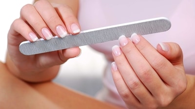 Shape and File: Use a nail file to shape your nails to your desired length and shape. File in one direction to avoid damaging the nail. (freepik ) Shape and File: Use a nail file to shape your nails to your desired length and shape. File in one direction to avoid damaging the nail. (freepik )