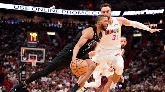 Brooklyn Nets forward Mikal Bridges (1) dribbles the ball past Miami Heat guard Max Strus (31) during the second half at Miami-Dade Arena.(USA TODAY Sports)