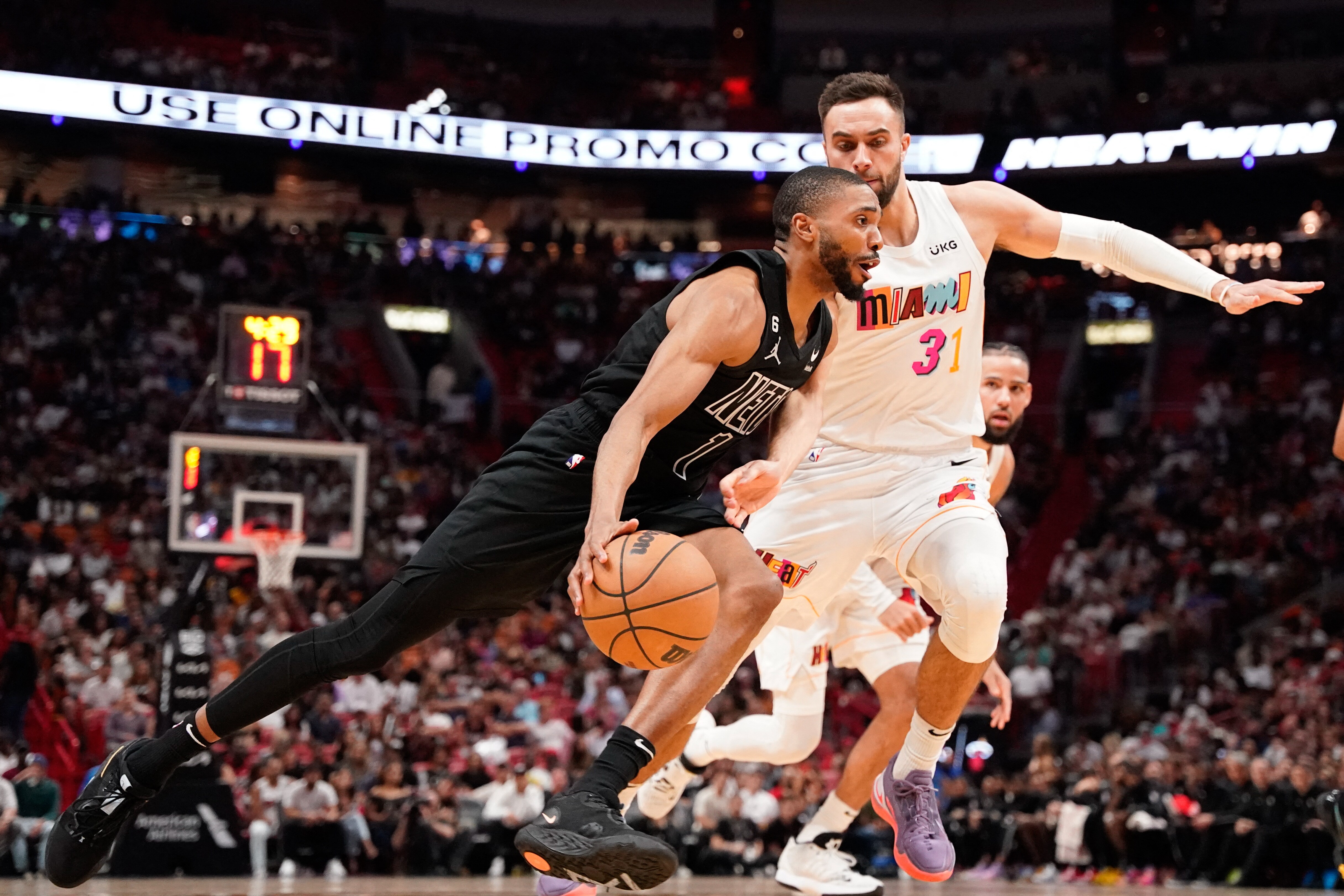 Brooklyn Nets forward Mikal Bridges (1) dribbles the ball past Miami Heat guard Max Strus (31) during the second half at Miami-Dade Arena. (USA TODAY Sports)