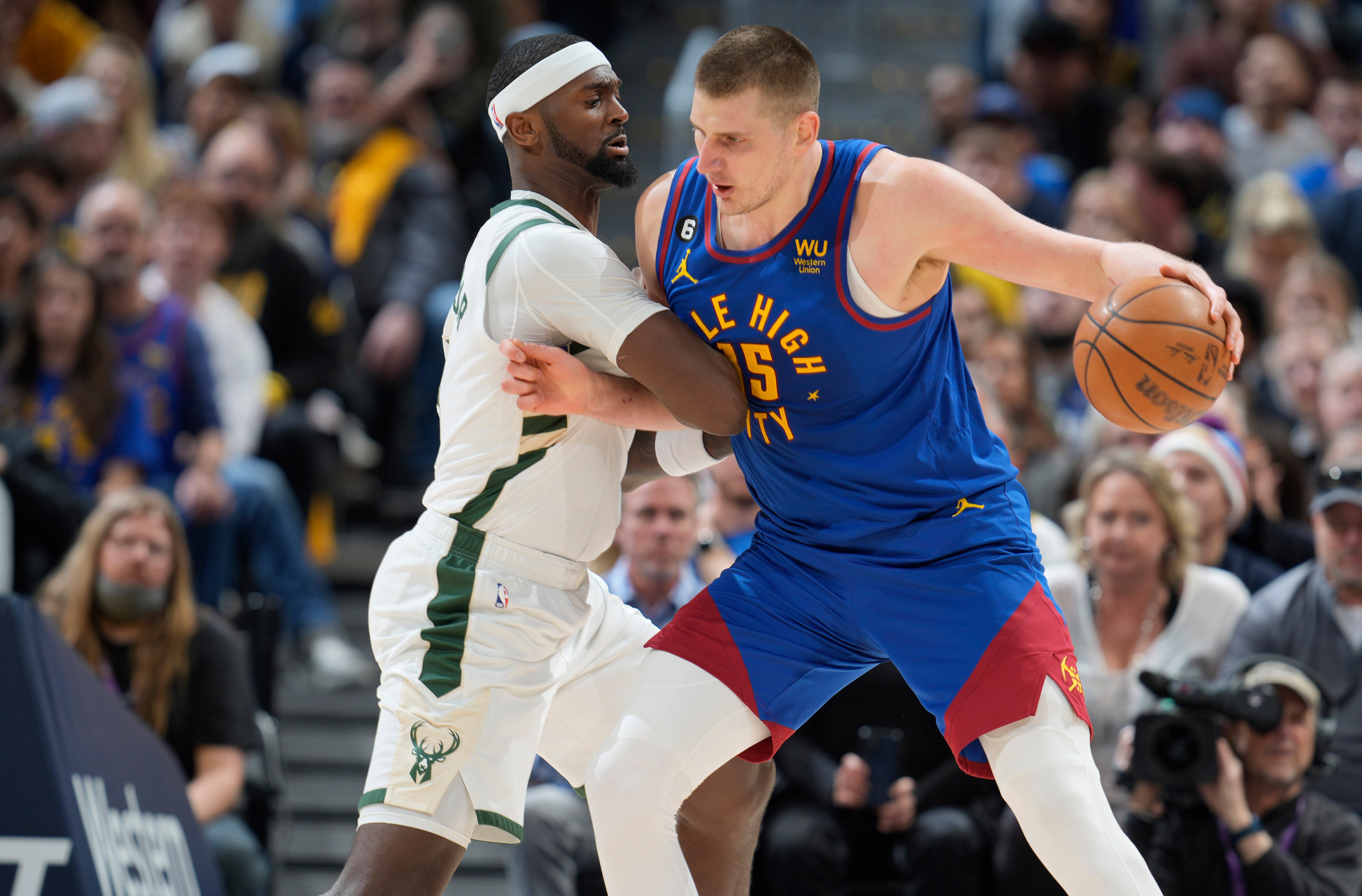 Denver Nuggets center Nikola Jokic, right, jostles with Milwaukee Bucks forward Bobby Portis in the second half of an NBA basketball game Saturday, March 25, 2023, in Denver. (AP) Denver Nuggets center Nikola Jokic, right, jostles with Milwaukee Bucks forward Bobby Portis in the second half of an NBA basketball game Saturday, March 25, 2023, in Denver. (AP)