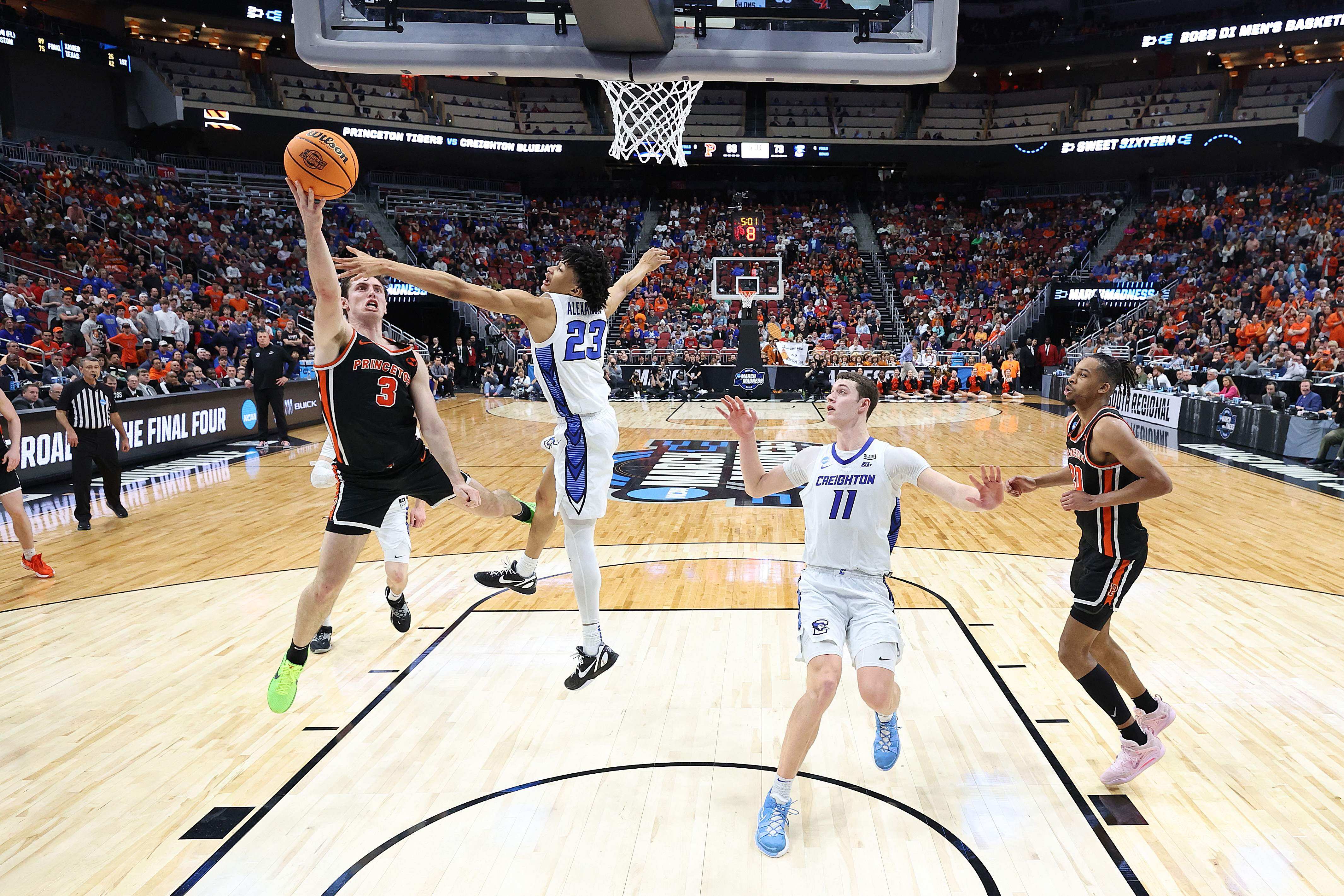 Ryan Langborg #3 of the Princeton Tigers shoots against Trey Alexander #23 of the Creighton Bluejays during the second half in the Sweet 16 round of the NCAA Men's Basketball Tournament at KFC YUM! Center on March 24, 2023 in Louisville, Kentucky. (Getty Images via AFP) Ryan Langborg #3 of the Princeton Tigers shoots against Trey Alexander #23 of the Creighton Bluejays during the second half in the Sweet 16 round of the NCAA Men's Basketball Tournament at KFC YUM! Center on March 24, 2023 in Louisville, Kentucky. (Getty Images via AFP)