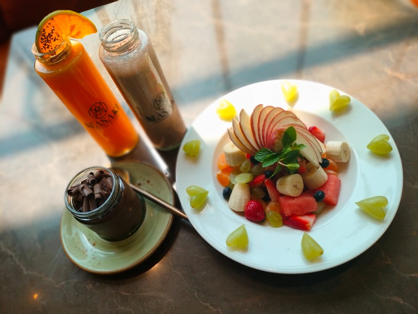 Exotic fruit salad platter and cold pressed fresh juices Exotic fruit salad platter and cold pressed fresh juices