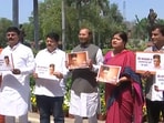 Maharashtra BJP MPs protest in front of the Shivaji statue in Parliament against Rahul Gandhi's comments on Savarkar.