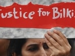 A woman holds a placard during a protest against the release of men convicted of gang-raping Bilkis Bano during the 2002 communal riots in Gujarat, in Mumbai.