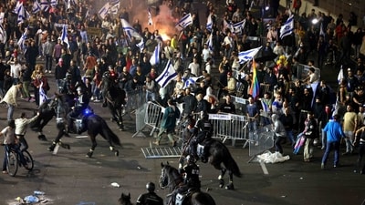 Protesters clash with the police during a rally against the Israeli government's judicial reform in Tel Aviv on March 27. President Isaac Herzog on Monday appealed to Netanyahu to immediately halt his controversial judicial overhaul, warning that the move has put the country's security, economy, and society under threat. (Ahmad Gharabli / AFP) Protesters clash with the police during a rally against the Israeli government's judicial reform in Tel Aviv on March 27. President Isaac Herzog on Monday appealed to Netanyahu to immediately halt his controversial judicial overhaul, warning that the move has put the country's security, economy, and society under threat. (Ahmad Gharabli / AFP)