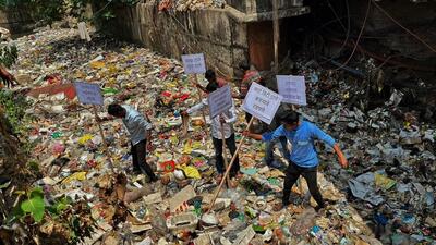 MNS party workers threatened to dump the waste accumulated in a nullah at Kapurbawdi at TMC headquarters if not cleared. The party workers staged a protest entering into the nullah with placards on Monday ,in Thane, in Mumbai, India, on,Monday, March, 27, 2023. (Praful Gangurde / HT Photo) MNS party workers threatened to dump the waste accumulated in a nullah at Kapurbawdi at TMC headquarters if not cleared. The party workers staged a protest entering into the nullah with placards on Monday ,in Thane, in Mumbai, India, on,Monday, March, 27, 2023. (Praful Gangurde / HT Photo)