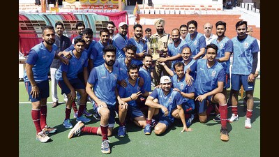 The team of Delhi Audit after their win at the IA&AD North Zone Hockey Championship at the Sector 42 stadium in Chandigarh on Monday. (HT Photo)